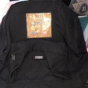 all black pink backpack with pins